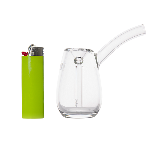 Clear glass smoking device and green lighter on a white background